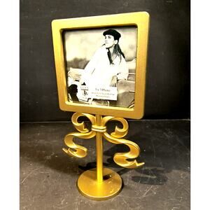 2230.  Gold Tone Metal Pedestal Tabletop Picture Frame Elsa Hollywood Regency